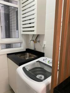 Apartamento em Condomínio Clube frente à praia do Campeche