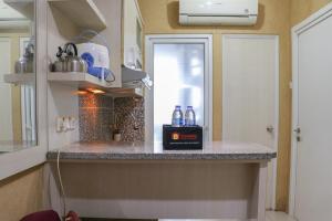 Fancy and Nice 2BR Apartment at Green Pramuka City By Travelio