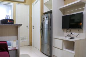 Fancy and Nice 2BR Apartment at Green Pramuka City By Travelio