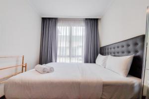 Modern Look and Comfy 1BR Asatti Apartment By Travelio