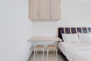 Minimalist and Warm Studio Room Akasa Pure Living BSD Apartment By Travelio