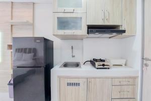 Minimalist and Warm Studio Room Akasa Pure Living BSD Apartment By Travelio