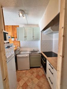 Appartements Charmant appartement au pied des pistes, avec une spacieuse terrasse ensoleillee : photos des chambres