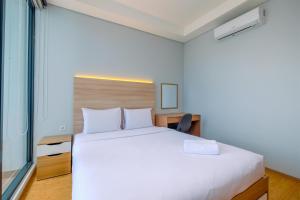 Modern and New 1BR across LRT Station Samara Suites Apartment By Travelio