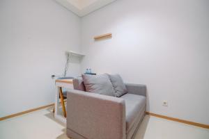Modern and New 1BR across LRT Station Samara Suites Apartment By Travelio