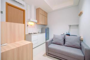 Modern and New 1BR across LRT Station Samara Suites Apartment By Travelio