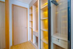 Modern and New 1BR across LRT Station Samara Suites Apartment By Travelio