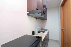 Combined 3BR Apartment without Living Room at Evenciio Margonda By Travelio