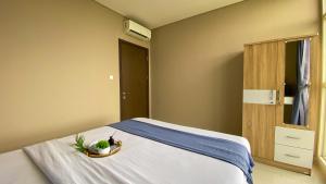 Nice and Wonderful 2BR Ciputra International Apartment By Travelio