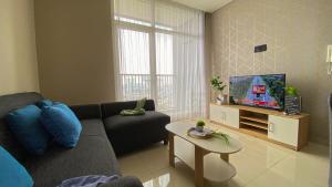 Nice and Wonderful 2BR Ciputra International Apartment By Travelio