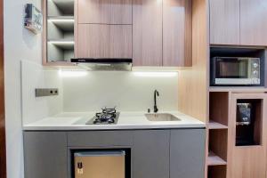 Simply Look and Comfort Studio Room at Casa de Parco Apartment By Travelio