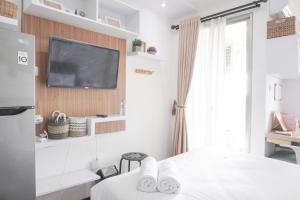 Fancy and Nice Studio at Belmont Residence Puri Apartment By Travelio