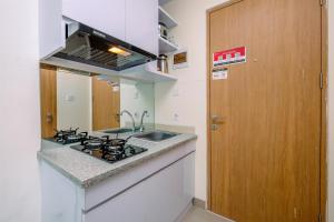 Elegant Studio Apartment at B Residence near AEON Mall By Travelio
