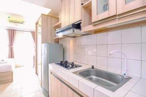 Simply Look Studio Room at Margonda Residence 2 Apartment By Travelio