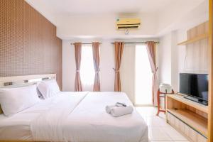 Simply Look Studio Room at Margonda Residence 2 Apartment By Travelio