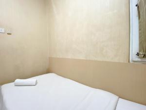 Cozy and Minimalist 2BR at Mutiara Bekasi Apartment By Travelio