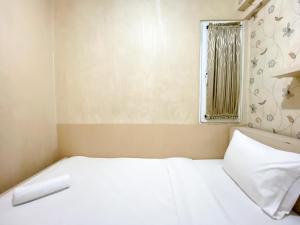 Cozy and Minimalist 2BR at Mutiara Bekasi Apartment By Travelio