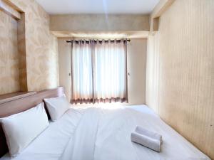 Cozy and Minimalist 2BR at Mutiara Bekasi Apartment By Travelio