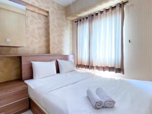 Cozy and Minimalist 2BR at Mutiara Bekasi Apartment By Travelio