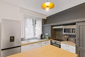 Appartements Les Suites de l-Arc-en-Ciel : photos des chambres