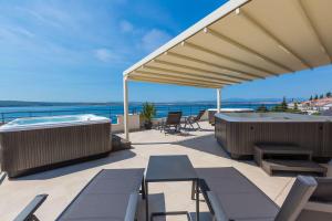 Beeindruckendes Apartment nur 100 Meter zum Strand mit Jacuzzi, Sauna, Meerblick, WiFi