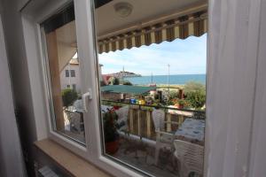 Charmantes Apartment nur 400 Meter zum Strand mit Meerblick, Grillbereich, Klima, WiFi