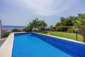 Modernes Apartment nur 300 Meter zum Strand mit Meerblick, Pool, Grill - hundefreundlich