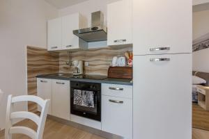 Renoviertes Apartment mit Meerblick, Fitnessraum, Babybett, Grillbereich