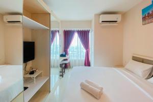 Cozy 1BR without Living Room Grand Kamala Lagoon Apartment By Travelio