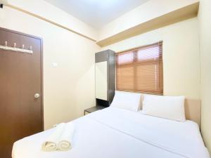 Modern Designed 2BR at Suites @Metro Apartment By Travelio