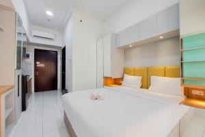 Warm and Cozy Stay Studio at Casa de Parco Apartment By Travelio