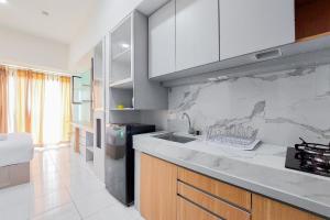 Warm and Cozy Stay Studio at Casa de Parco Apartment By Travelio