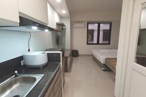 Relaxing Studio at 5th Floor Altuz Seturan Yogyakarta Apartment By Travelio