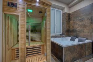 Appartements L-Ame Etoilee - Love Room avec Balneo & Sauna : photos des chambres