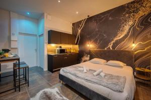Appartements L-Ame Etoilee - Love Room avec Balneo & Sauna : photos des chambres