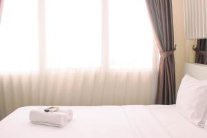 Cozy and Comfort Living 1BR at Oasis Cikarang Apartment By Travelio