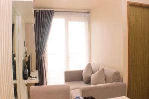 Cozy and Comfort Living 1BR at Oasis Cikarang Apartment By Travelio