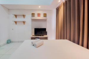 Tranquil and Homey Studio at Casa De Parco Apartment By Travelio