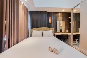 Tranquil and Homey Studio at Casa De Parco Apartment By Travelio