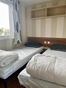Maisons de vacances Mobilhome close to the pool - Cc110 Siblu Les Charmettes : photos des chambres