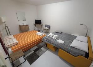 Chez Jean-Claude Chambre 4 personnes Un lit et un divan lit