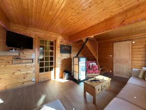 Maisons de vacances Le chalet des Broches - jacuzzi : photos des chambres