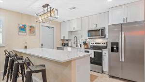 The Shark Tank Cocoa Beach - 2 2BR Units - 4BR Total - Each Unit Sleeps 5 - Walk to Downtown & Beach