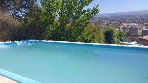 Chalet de Montaña a 8 cuadras del centro de Carlos Paz con pileta de 9 x 4