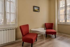 Appartements Logements A 2 PETITS PAS : photos des chambres