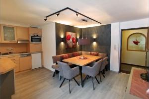 Three-Bedroom Apartment with Balcony room in Haus Enzian