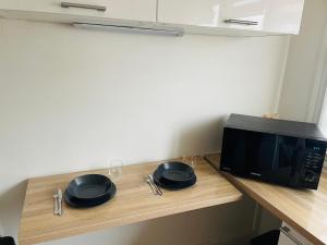 Appartements appartement tout confort a 10min Paris la Defense : photos des chambres