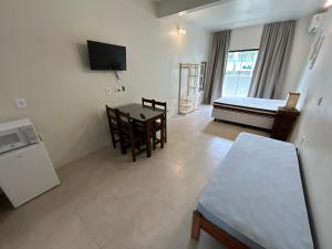 Brisa Ferrugem apenas uma quadra da Praia da Ferrugem e Bar do Zado