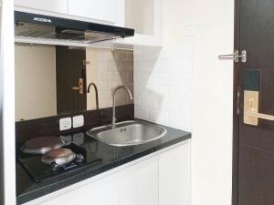 Luxury Studio at Patraland Amarta Apartment By Travelio