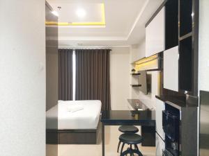 Luxury Studio at Patraland Amarta Apartment By Travelio